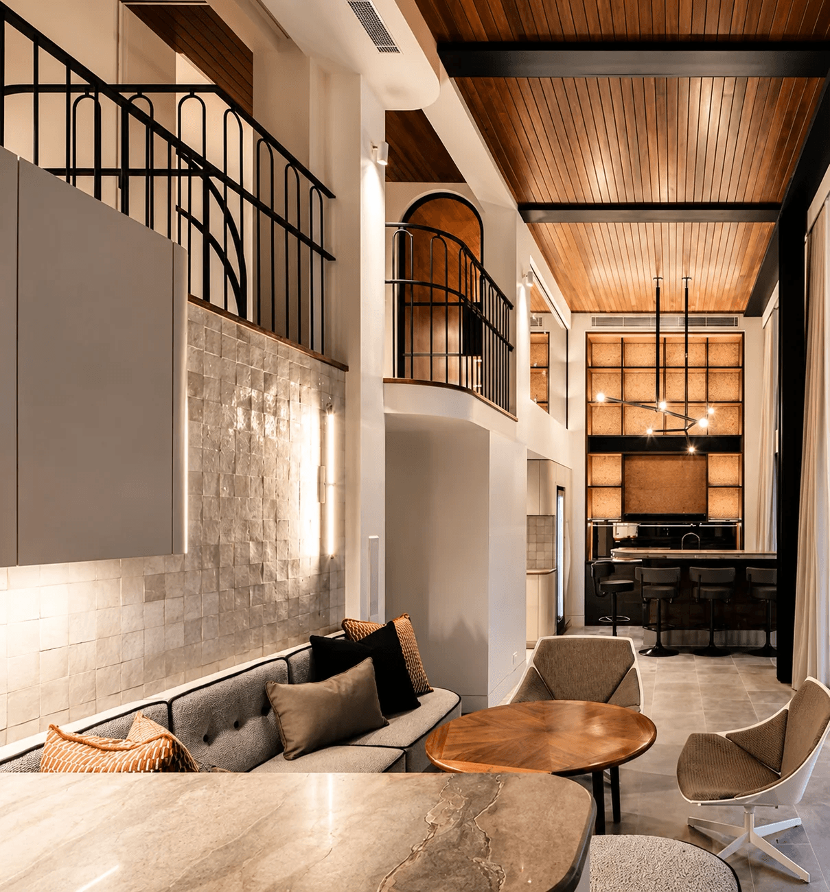 High-end interior painting — double-height living space by Limitless Painting & Decorating