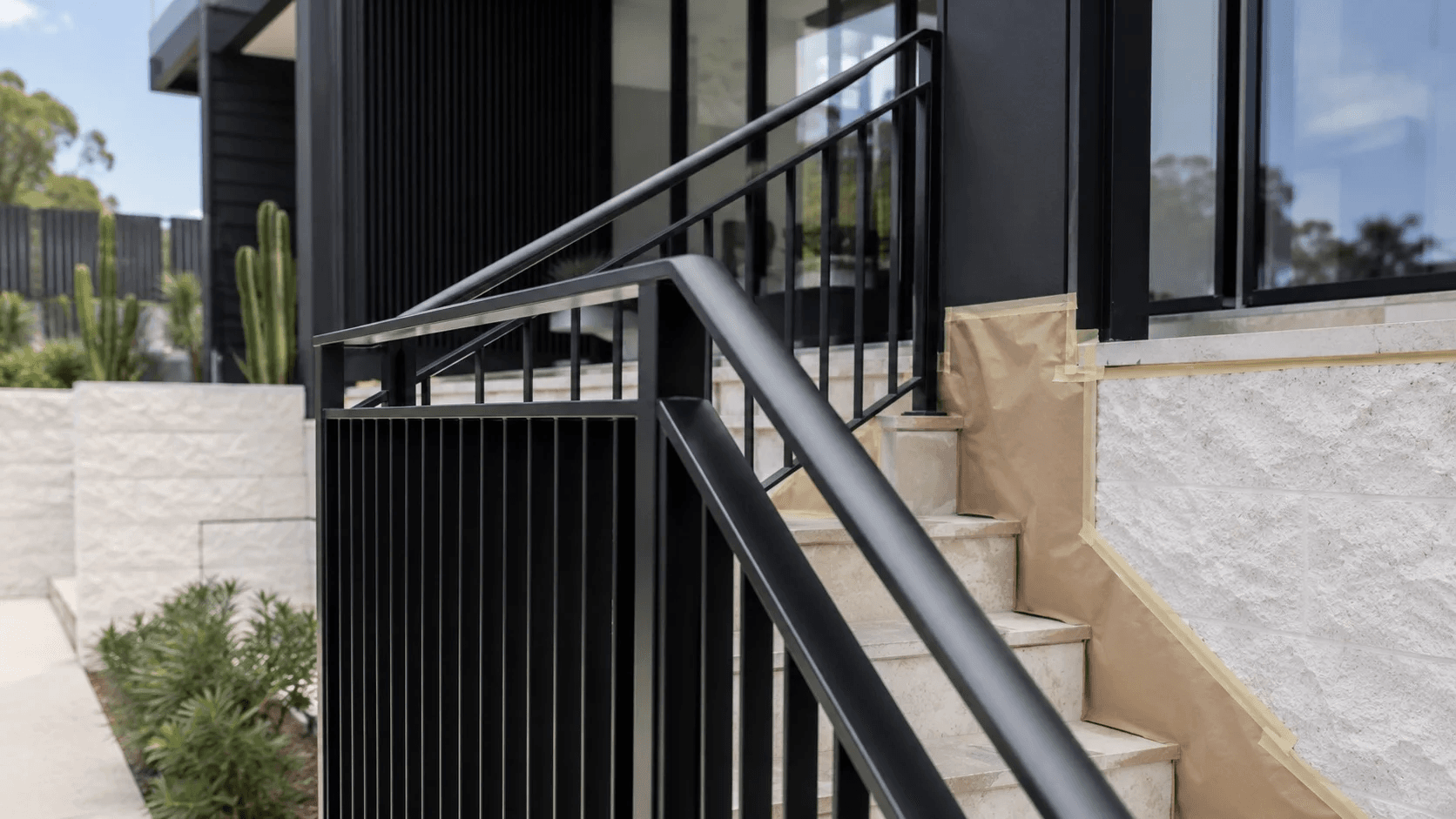 Protective coating system applied to a steel balustrade and handrail on a Sydney home — Limitless Painting